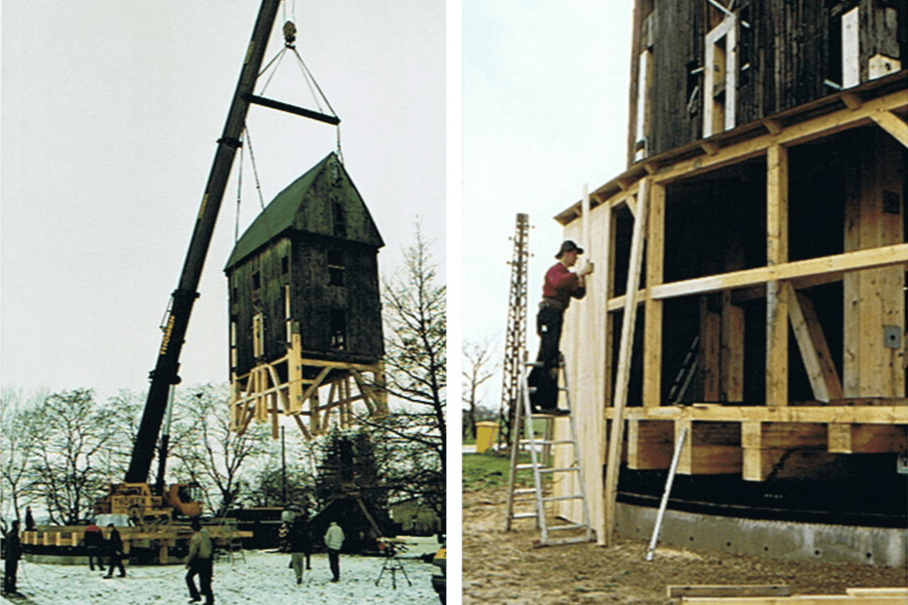 Image de la construction d'un bâtiment avec une grue et des ouvriers du bâtiment.