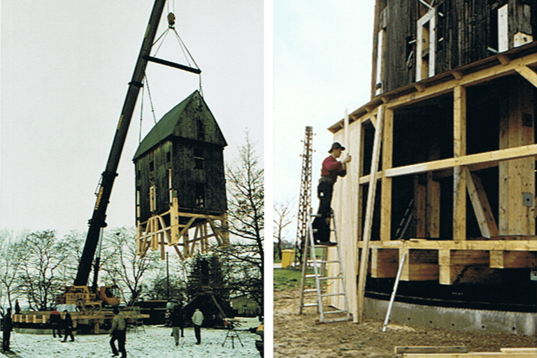 Image de la construction d'un bâtiment avec une grue et des ouvriers du bâtiment.