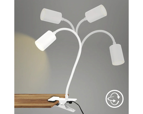 Klemmleuchte mit vier Armen und verstellbaren Leuchtenköpfen an einem Tisch befestigt