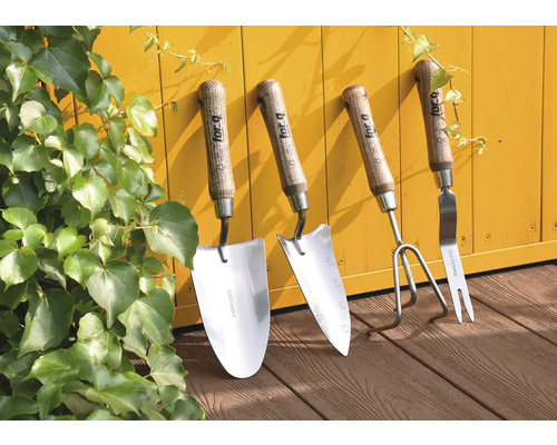 Set d''outils de jardin composé d''une plantoir, d''un transplantoir, d''une binette et d''une fourche à main sur fond jaune