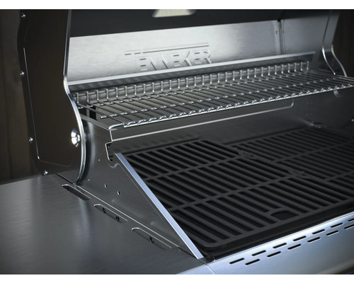 Vue intérieure d''un gril en acier inoxydable avec grille de cuisson et grille de maintien au chaud