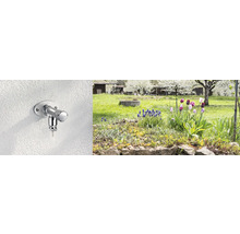 Robinet d''extérieur sur un mur avec jardin en arrière-plan