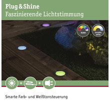 Spots encastrables au sol avec différentes couleurs pour l''éclairage du jardin.