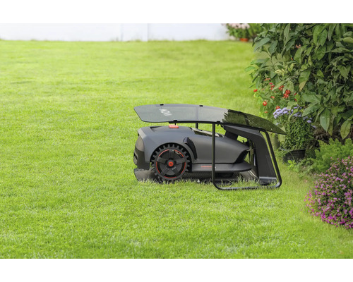 Robot tondeuse avec station de charge sur pelouse