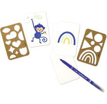 Kit de bricolage avec stylos, pochoirs et motifs sur papier pour projets créatifs.