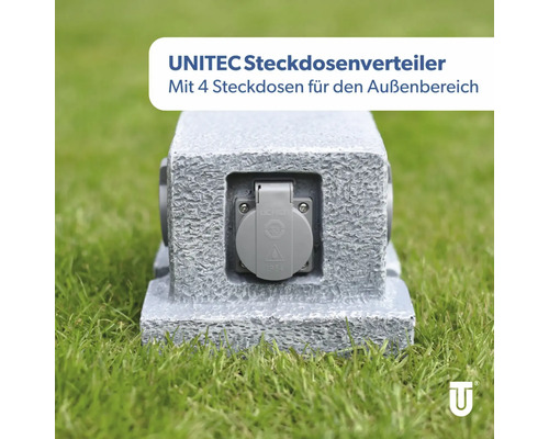 Unitec Steckdosenverteiler mit vier Steckdosen für den Außenbereich auf Rasen