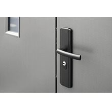 Gros plan d''une porte grise avec une poignée de porte noire