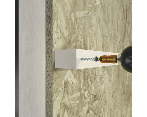 Anbringen eines Holzstücks mit einer Schraube an einer Wand mit einem Schraubenzieher