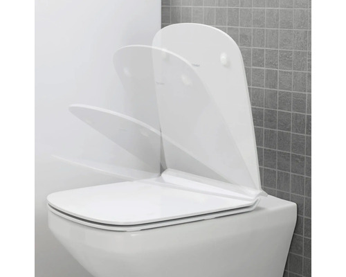 WC blanc avec abattant de toilette dans différents angles d'ouverture.