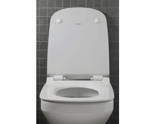 Abattant de WC blanc avec couvercle de Duravit, légèrement ouvert