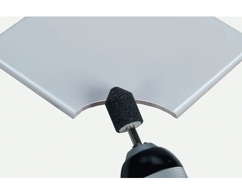 Trépan coupant un bord de carreau