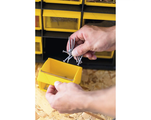 Tiroir jaune avec clous pour armoire à outils