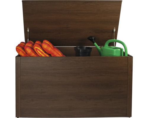 Coffre de rangement ouvert avec coussins, arrosoir et pot de fleurs