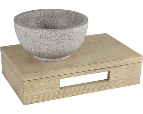 Vasque à poser grise en pierre sur un meuble sous-vasque en bois