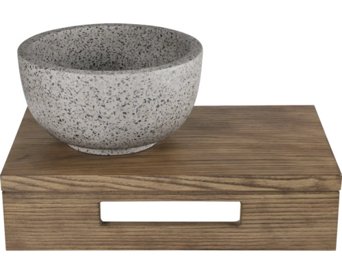 Bol décoratif en pierre sur une boîte en bois