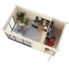 Vue intérieure d'une cabane de jardin avec bureau, espace de vie et tondeuse à gazon