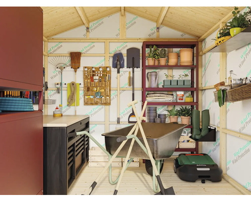 Intérieur d'abri de jardin avec établi, étagères, brouette et outils de jardin.