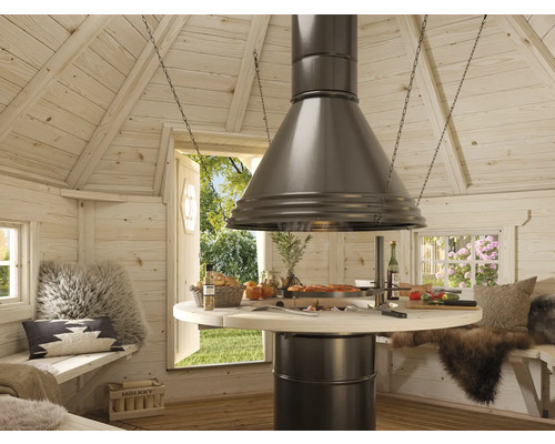 Vue intérieure d'un kota grill avec table de cuisson ronde et cheminée