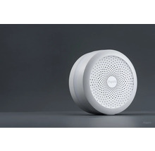 Logo Aqara sur un appareil domotique intelligent sans fil rond