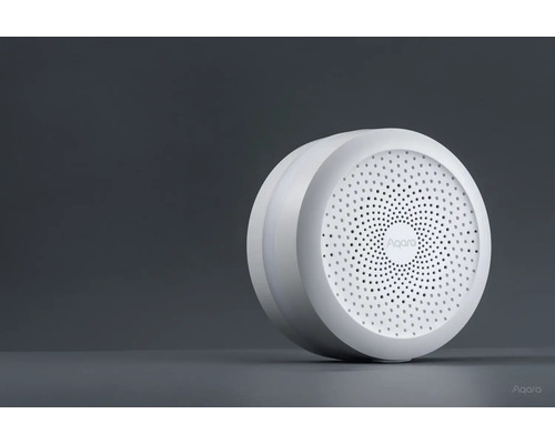 Logo Aqara sur un appareil domotique intelligent sans fil rond