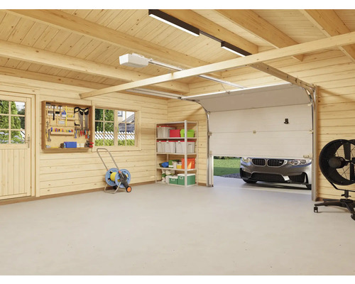 Garage lumineuse avec murs en bois, panneau à outils, étagère et porte de garage partiellement ouverte