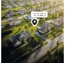 Luftaufnahme einer Wohngegend mit Häusern, Gärten und Strassen