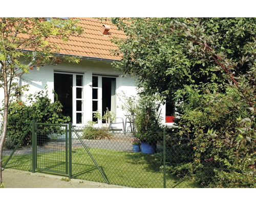 Maison avec clôture de jardin et portillon