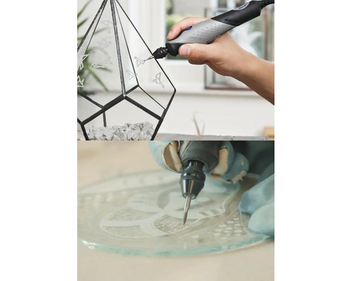 Dremel Multifunktionswerkzeug beim Gravieren von Vogelmotiven auf ein geometrisches Glas-Terrarium und eine Glasplatte.