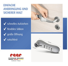 Protection de poignée de porte en silicone reer, montage sur une poignée de porte, 13 centimètres de long, flexible et antidérapant. Logo reer.