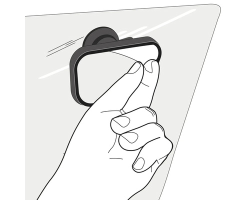 Eine Hand stellt einen kleinen rechteckigen Toter-Winkel-Spiegel ein der an einer Glasscheibe befestigt ist.