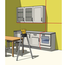 Laser à lignes croisées sur trépied pour l'alignement des éléments de cuisine avec lignes laser rouges projetées sur le mur.
