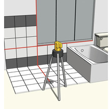 Laser à lignes croisées sur trépied dans la salle de bain pour l'alignement horizontal et vertical des carreaux muraux et de sol.