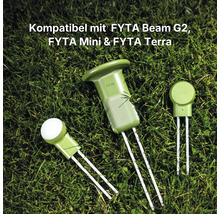 Trois capteurs de plantes FYTA des modèles Beam G2, Mini et Terra avec des sondes métalliques sur une pelouse.