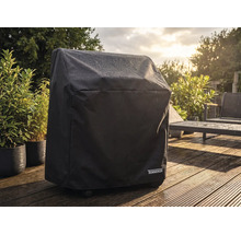 Wasserabweisende Tenneker Grill-Abdeckhaube auf einer hellen Holzterrasse im Garten bei Regen.
