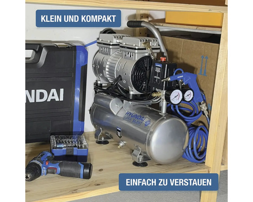 Compresseur Hyundai Super Silent petit et compact rangé sur une étagère en bois avec accessoires et perceuse sans fil