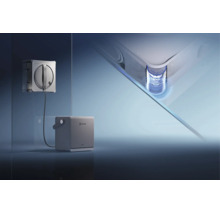 Robot laveur de vitres Ecovacs nettoyant une vitre avec une station de base séparée et une vue détaillée de la technologie de nettoyage des coins.