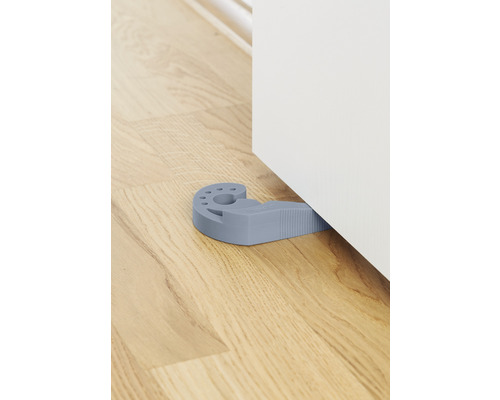 Türstopper aus Kunststoff unter einer Tür