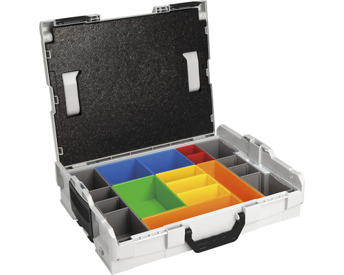 Boîte à outils ouverte avec inserts colorés pour ranger les outils et les accessoires.