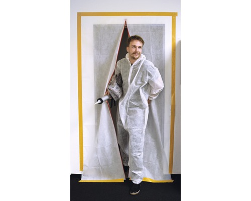 Handwerker in Schutzanzug mit Dichtpistole und Staubschutztür