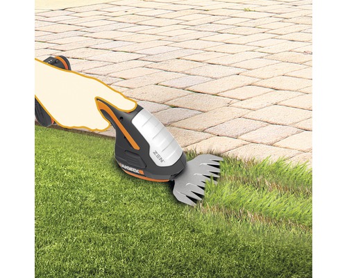 Cisailles à gazon sans fil en cours d''utilisation pour couper les bordures de la pelouse