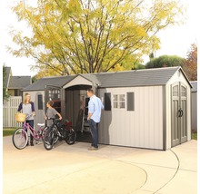 Abri de jardin spacieux avec famille et vélos dans l''allée