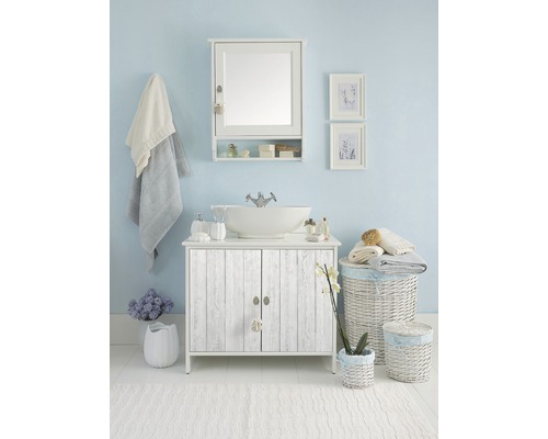 Ensemble de salle de bains avec meuble sous-vasque, miroir, accessoires et décorations pour une atmosphère claire et conviviale