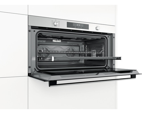 Four encastrable avec porte ouverte et grille de barbecue