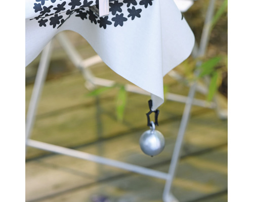 Nappe avec décor floral et poids de nappe