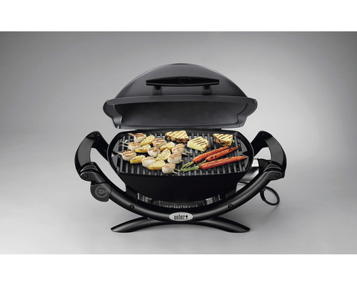 Offener schwarzer Elektrogrill mit Grillgut