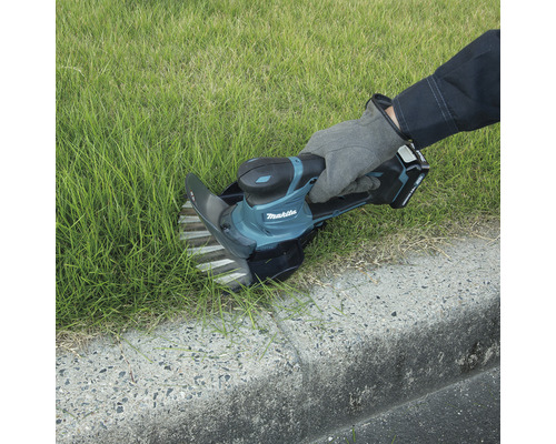 Makita Grasschere bei der Rasenpflege
