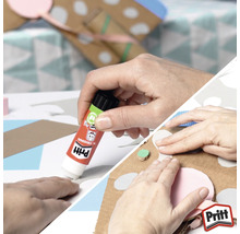 Une personne utilise un bâton de colle pour faire du bricolage.