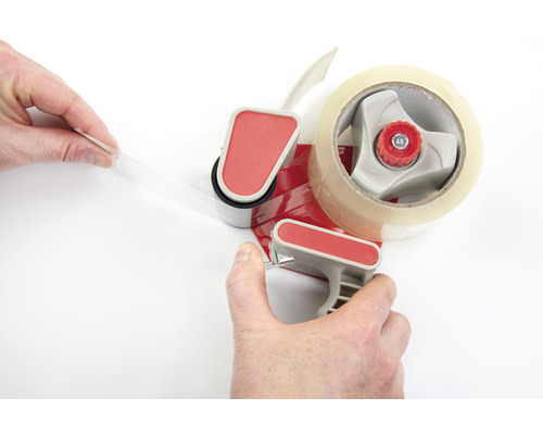 Klebebandabroller mit Klebeband in Aktion