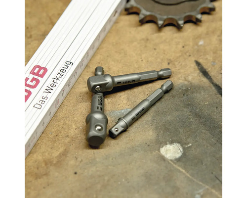 Drei Steckschlüssel Adapter mit Zollstock und Zahnrad