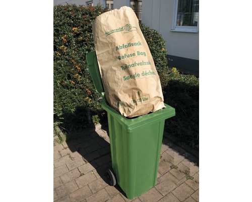 Poubelle verte avec un sac à ordures plein